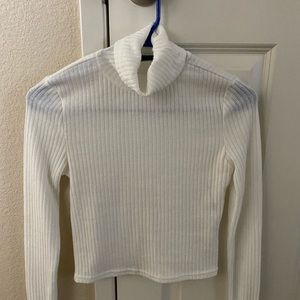 Turtleneck crop top with rolled up sleeves